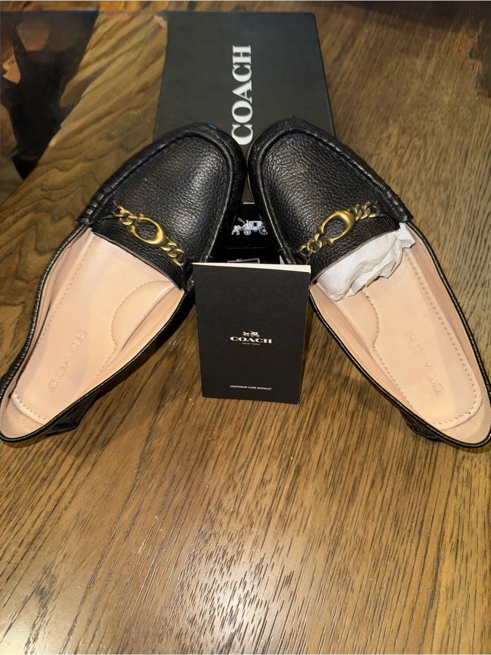 Coach Black Leather Loafers with Gold Chain Accent